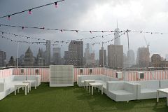 07-09 Outdoor Bar Vacated In The Rain With View To World Trade Center And Financial District From The Rooftop At NoMo SoHo New York City.jpg